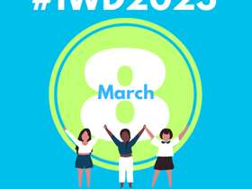 Graphic logo text reads IWD 2023, SCC three characters stand in a pose of celebration hand in hand arms outstretched.