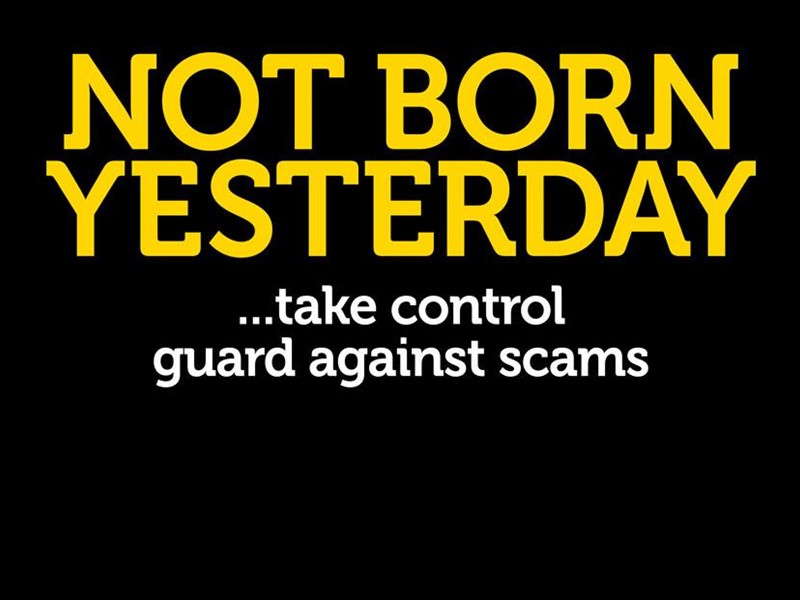 Black background with the words Not Born Yesterday in yellow text